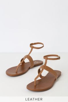 Add a pop of cute to your outfit with the Lulus Colleen Cognac Vachetta Leather Flat Sandals! Sleek vachetta leather forms these cute sandals with a T-strap upper and matching, adjustable ankle strap with gold buckle. 0. 25" rubber heel. Lightly cushioned insole. Rubber sole has nonskid markings. Genuine leather upper. Balance man made materials. Imported. Lulus | Colleen Cognac Vachetta Leather Flat Sandal Heels | Size 8. Brown Leather T-strap Sandals For Spring, Trendy T-strap Sandals With Adjustable Single Toe Strap, Spring T-strap Sandals With Adjustable Toe Post, Spring Toe Post T-strap Sandals With Adjustable Strap, Chic T-strap Sandals With Toe Post And Buckle Closure, Brown T-strap Sandals With Adjustable Strap For Vacation, Chic Summer T-strap Sandals With Adjustable Strap, Brown Toe Post T-strap Sandals For Spring, Chic Ankle-strap T-strap Sandals For Vacation