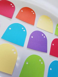 colorful paper cut out with holes in the middle