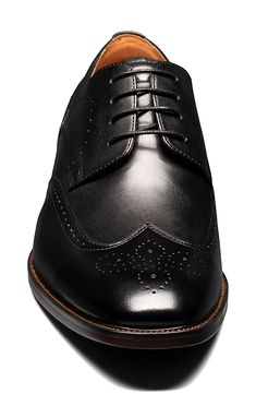 Brogue details add timeless style to a wingtip derby grounded by a well-cushioned footbed. Cushioned footbed Leather upper and lining/rubber sole Imported Classic Black Derby With Brogue Detailing, Classic Black Derby Shoes With Brogue Detailing, Black Wingtip Derby Shoes, Black Wingtip Oxfords For Derby, Black Wingtip Dress Shoes For Derby, Black Wingtip Derby Shoes With Goodyear Welt, Black Goodyear Welted Wingtip Derby Shoes, Business Wingtip Oxfords With Removable Insole, Black Wingtip Derby For Semi-formal Occasions