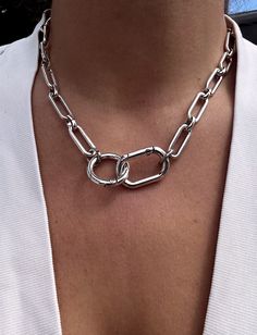 An edgy and modern, oval link chunky chain necklace with a front-facing double carabiner clasp. This is a great piece for making a statement in a minimalist style.  ▪️Oval link chain, silver plated zamak  ▪️Carabiner clasps, silver plated zamak ▪️Fastens at front ▪️The necklace will be presented in attractive Scraffs packaging  ++ Check out our Etsy shop for lots of other fabulous jewellery and accessories www.etsy.com/shop/scraffs ++ Minimalist Link Jewelry With Carabiner Clasp, Chic Silver Oval Link Chain Necklace, Link Necklaces With Carabiner Clasp, Silver Necklaces With Hook And Links For Everyday, Everyday Silver Necklace With Hook And Links, Elegant Chain Link Necklaces With Carabiner Clasp, Trendy Chain Link Jewelry With Hooks, Silver Link Jewelry With Carabiner Clasp, Everyday Oval Link Necklace With Carabiner Clasp