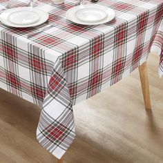 a plaid table cloth with two plates on it