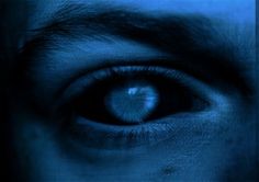 a man's blue eye is shown in this artistic photo, with only the iris visible