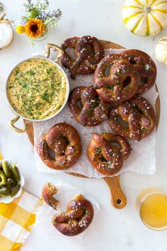 This recipe for Dill Pretzels with Cider Cheese Dip & it's just what you want to indulge in on a cold, crisp day. The pretzels are perfectly balanced in texture and flavor with a chewy, deep mahogany exterior and light and airy center. Topped with crunchy sea salt flakes and a hefty sprinkle of fresh dill. The velvety cider cheese dip combines hard apple cider with sharp cheddar, zippy spicy brown mustard and plenty of herbs in a flavor forward dip. Dill Pretzels, Pear Galette, Puffed Pastry, Pretzel Dough, Baking Soda Bath, Hard Apple Cider, Festive Recipes, Beer Cheese Dip, Refreshing Beverages