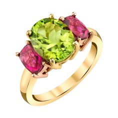 Featuring a bright and cheerful pairing of spring green peridot and vibrant fuchsia-pink tourmalines, this luscious ring is guaranteed to put a smile on your face! The peridot is a beautifully brilliant grass green oval weighing 2.73 carats and the hot pink tourmalines, also referred to as "rubellite," have spectacular color. A wonderfully uplifting ring perfectly suitable for daytime and evening wear! Handcrafted in precious 18k rose and yellow gold by our Master Jewelers in Los Angeles. Perido Yellow Gold Cocktail Ring, Spessartite Garnet, Rubellite Tourmaline, Peridot Jewelry, Yellow Gold Diamond Ring, Gold Cocktail Ring, Gold Cocktail, Peridot Ring, Colored Gems