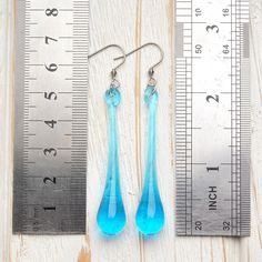 "These Light blue long teardrop dangle earrings are made of glass in lampwork technique. The stainless steel hooks are hypoallergenic. They will not tarnish, fade, or discolor with time. These unique and beautiful earrings are like water drops frozen in glass! They are simple and elegant, very lightweight and comfortable to wear, perfect for everyday wear and for special occasions. You will definitely receive lots of compliments on your new earrings, everybody loves them, and you'll love them to Black Statement Earrings, Teal Earrings, Blue Dangle Earrings, Glass Drop Earrings, Teardrop Dangle Earrings, Long Drop Earrings, Black Earrings, Lampwork Glass Beads, Elegant Earrings