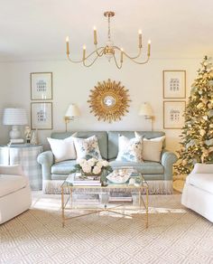 a living room filled with furniture and a christmas tree in front of the couches