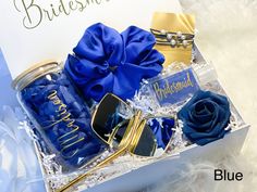 a gift box with blue roses and sunglasses