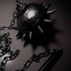 a metal ball with spikes and chains attached to it