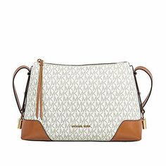 Get the luxe look when you carry the MICHAEL Michael Kors Crosby Medium Messenger bag. leather  Zipper closure. Adjustable crossbody strap. Signature logo hardware detail at front. Flat bottom. Lined interior. Interior zip and slip pockets. Bottom Width: 11 3⁄4 in Depth: 3 3⁄4 in Height: 7 1⁄2 in Strap Length: 42 in Strap Drop: 18 1⁄2 in Weight: 1 lb 0.2 oz Messenger Bag Leather, Messenger Handbags, Woman Bags Handbags, Purses Michael Kors, Leather Zipper, Louis Vuitton Bag Neverfull, Signature Logo, Carousel, Michael Kors Monogram