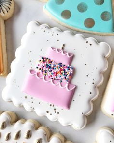 some decorated cookies are sitting on a table