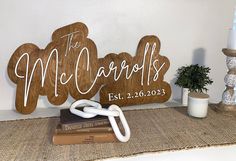 a wooden sign that says the mr and mrs on it next to some other items