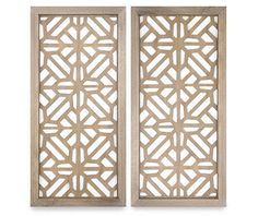 two wooden wall panels with geometric designs on each panel, one in white and the other in beige