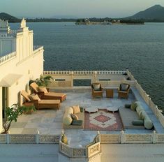 an outdoor seating area overlooking the water