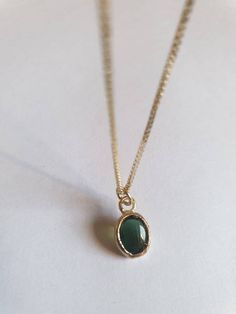 This minimalist Green Tourmaline, solid gold necklace was designed with a bottle green see through pendant, to beautifully accompany you through your busy days. The classic simple design is always pretty for day and evening, work or fun. The gold Tourmaline necklace is handmade and delicate and available both with a 9kt or a 14 karat pendant. The solid gold chain is made of 14k and available in a of couple lengths. The clear Green Tourmaline necklace is a perfect chic and elegant gift. The penda Minimalist Yellow Gold Emerald Necklace For Gift, Minimalist Gold Emerald Necklace, Minimalist Emerald Pendant Necklace, Minimalist Everyday Emerald Pendant Necklace, Minimalist Emerald Necklace With Delicate Chain, Minimalist Green Pendant Birthstone Necklace, Minimalist Green Charm Necklace For Everyday Wear, Minimalist Green Charm Necklace For Everyday, Green Minimalist Charm Necklace For Everyday