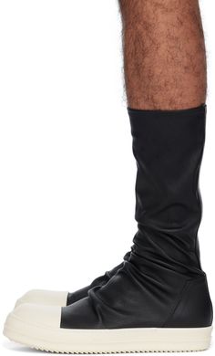 High-top stretch grained lambskin slip-on sneakers in black. · Buffed calfskin cap toe �· Sock-style collar · Padded calfskin footbed · Treaded thermoplastic rubber sole Supplier color: Black/Milk/Milk Rick Owens Boots, Milk Brands, Sock Style, Black Shoes Men, Sock Sneakers, Lipstick Bag, Chain Strap Bag, Toe Socks, Floral Shoes