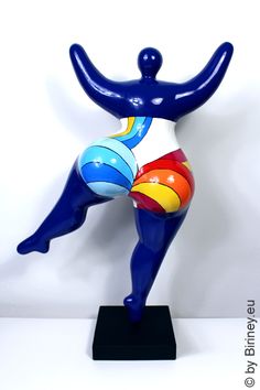 a blue figure with colorful designs on it's body and legs, standing in front of a white background