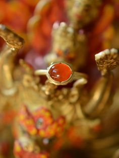 The fiery orange-red colour of this incredible and aptly named Mexican Fire Opal is reminiscent of glowing embers. I love the intensely saturated natural colour of this stone and the luminescent depth within it. One of a kind, this ring features a hand-forged 18k solid gold ring shank and a buttery 22k yellow gold bezel. Materials: Mexican Fire Opal, 18k and 22k yellow gold Size 7.5 Send me a direct email at hello@lorifrancescutti.com with any questions about this or another piece. Hand Forged Red Ruby Ring, Hand Forged Ruby Ring In Red, Red Gemstone Rings For Ceremonial Occasion, Red Gemstone Ring For Ceremonial Occasions, Ceremonial Red Gemstone Ring, Red Carnelian Wedding Rings, Red Carnelian Wedding Jewelry, Orange Ruby Gemstone Ring For Gift, Orange Gemstone Spiritual Rings