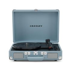 the crosley portable record player is shown in its blue case with an open lid