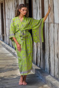 Recalling Bali's batik heritage, Saktut Raitawati designs a green border print robe with purple fern motifs. Classic front-wrap styling, wide kimono sleeves and a matching tie belt combine for graceful line. The patterns are created with the silk screen technique. materials: 100% rayon Handcrafted batik art--colors and pattern placement will vary In seam pocket(s) Belt: 77 in. L x 3.1 in. W Dry in the shade;Hand wash or machine wash on gentle cycle Fern Forest, Purple Palette, Thumb Piano, Batik Art, Fern Leaf, Printed Robe, Womens Kimono, Sari Silk, Kimono Style