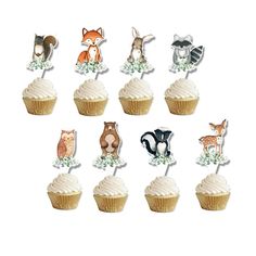 cupcake toppers with animals on them are arranged in the shape of an animal