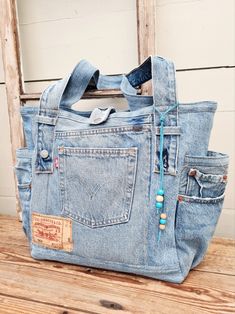 an old pair of jeans has been transformed into a purse