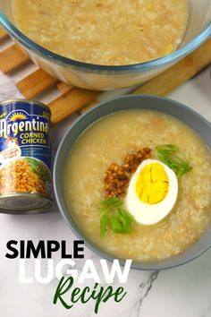 a bowl of soup with an egg on top and a can of cereal in the background