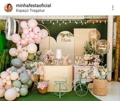 a table with balloons and other decorations on it