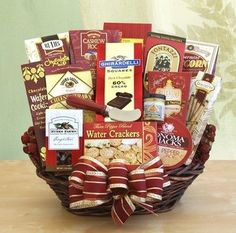 a gift basket with wine, crackers and snacks