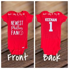 Newest Phillies Fan is perfect for that little bundle of joy! Newest Phillies Baby Bodysuit is red with the design made with commercial grade iron on vinyl. Add a name and number to the back of the bodysuit! This bodysuit is available in 0-3 months, 3-6 months, 6-9 months, 12 months and 18 months.  Bodysuit available in SHORT SLEEVE ONLY. Name and number design is made with commercial grade iron on white vinyl. Baby bodysuit is made by Gerber. Double check spelling of name-not responsible for names spelled wrong at check out **Colors may vary from screen to screen from actual product** NOTE: Due to the post office (USPS) delays, I cannot guarantee shipment at a specific delivery date. Bodysuits are shipped via USPS First Class Shipping. If you would like your order to arrive faster, I reco Red Fitted Bodysuit For Casual Wear, Red Fitted Bodysuit For Playtime, Cricut Phillies Shirt, Phillies Crewneck, Phillies Dancing On My Own, Baseball Snacks, Vintage Phillies Sweatshirt, Phillies Shirt, Phillies Baseball