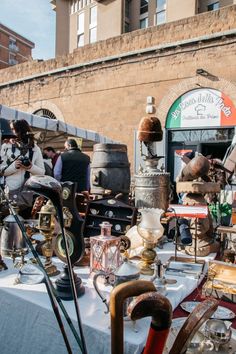 an outdoor flea market with antique items on display