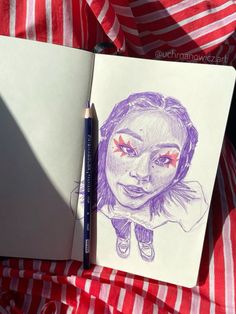 a pencil drawing of a girl with red eyes and pink cheeks on a sheet of paper