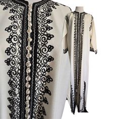 Vintage white caftan-trimmed with decorative black embroidery, side slits, tiny buttons, festival hippie chic kaftan, mint vintage. M-L. This caftan is mint, It doesn't appear to have been worn. Crisp white and inky black chain stitch embroidery remains fresh, the fabric buttons in the front are just extra fancy!  Pullover caftan, has long open kick pleats on each side. label: n/a size: n/a fabric: n/a but feels like pure mid-weight cotton chest: up to 40 inches (will be more comfortable for a 38 inch chest) waist: up to 40 inches hips: up to 40 inches open side kick pleats: 15 inches length shoulder to shoulder: 18 inches length: 57 No returns or refunds, please read store policies prior to purchase. Elegant White Kaftan For Festival, Black Long Kaftan With Intricate Embroidery, Embroidered Long Abaya For Festival, Long Embroidered Abaya For Festival, White Bohemian Abaya For Spring, Embroidered Long Thobe For Festival, White Bohemian Long Abaya, White Long Bohemian Abaya, Long Black Bohemian Kurta