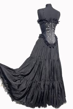 H6/2 #RC23N  This is beautifully made  gothic outfit with boned Corset is black/silver fleur-de woven satin heavy brocade with Front Corseted and spaghetti straps ,it has Sides black Lycra Panels and back zip up. Boned Corset is Available in 3 Sizes S/34"M/36"L/38"Bust. black satin fabric layer/tiered very wide flared satin Skirt is fully  lined ,hangs well when worn.  with sides elasticated  with stretch to fit waist size 34" and without stretch waist 28" Skirt is one size and can fit up to 34" Long Tiered Skirt, Black Satin Fabric, Boned Corsets, Satin Skirt, Gothic Outfits, Black Satin, Satin Fabric, Spaghetti Strap, Zip Ups