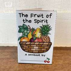 the fruit of the spirit book on a wooden table