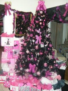 a christmas tree with pink and black decorations