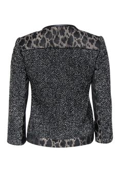 Size 2 Black & Grey Tweed & Leopard Print Jacket Comes w/original tags Retails for $548.00 Shell 70% virgin wool 30% nylon Yoke, center front, under sleeves, hem 43% acetate 33% wool 24% polyester Lining 95% polyester 5% elastane Trim 100% leather Lightly padded shoulders Concealed snap buttons down front Decorative hip pockets Shoulder to shoulder 14.5" Sleeve length 19.75" Bust 34.5" Waist 32" Shoulder to hem 21" Fitted Black Tweed Jacket For Winter, Black Wool Tweed Jacket For Fall, Tailored Black Tweed Jacket For Winter, Leopard Print Jacket, Grey Tweed, Elie Tahari, Print Jacket, Black Grey, Leopard Print