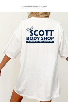 Celebrate your love for One Tree Hill and channel your inner Lucas Scott with this stylish Keith Scott Body Shop graphic tee. Featuring a unique blend of Y2K nostalgia, 2000s-inspired fashion, and a touch of the show's iconic aesthetic, you'll be stepping out in style all season long. Don't miss your chance to own this must-have wardrobe addition – Get Yours Now! Iconic Aesthetic, Nostalgia 2000s, Y2k Nostalgia