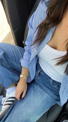 Blue striped button up, gold watch, sambas, white singlet and sambas Summer Outfits With Blue Jeans, Denim Jeans Aesthetic Outfit, Blue Jeans White Shirt Women, Outfits With Blue Shirts Casual, Blue Jeans Blue Shirt Outfit, Blue Striped Shirt Women Outfit, Blue Button Up Shirt Outfit Summer, Shirt Combinations Women, Women Blue Shirt Outfit