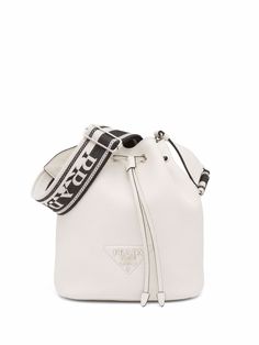 White leather Flou bucket bag from PRADA featuring triangle logo, silver-tone logo lettering, silver-tone hardware, logo shoulder strap, drawstring fastening, main compartment and internal patch pocket.