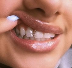 a close up of a person brushing their teeth