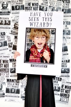 a person holding up a poster with the words have you seen this wizard?