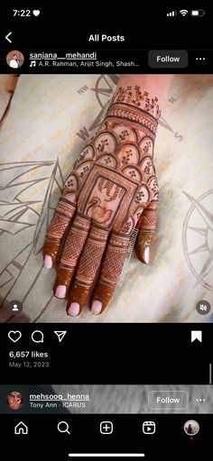 an image of someones hand with henna on it