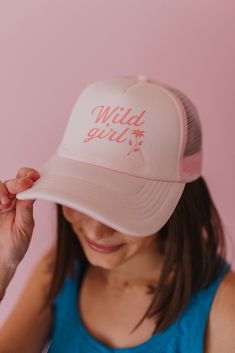 These trucker hats are our new favorites, and they will be yours too! Each style of hat has an adjustable band. Wear them with your hair down or up, and it will instantly make any outfit complete. This hat is pink with, "Wild Girl" printed in darker pink, colored text. Spring Beach Trucker Hat, 5-panel, Trendy 5-panel Trucker Hat For Beach, Trendy 5-panel Summer Baseball Cap, Trendy Summer 5-panel Snapback Hat, Trendy 5-panel Snapback Hat For Summer, Adjustable 5-panel Snapback Hat For Spring, Summer Trendy Trucker Hat With Curved Bill, Trendy Summer Trucker Hat With Curved Bill, Trendy Trucker Hat Baseball Cap For Spring