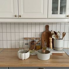 the kitchen counter is clean and ready to be used as a cooking area for dishes