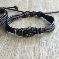 "These lovely bracelets are made with waxed cord, brown rubber spacers, and sterling silver links. Designed for couples If you choose \"Custom Initials Set\" Please leave me a note at checkout with the initials. Both bracelets are adjustable. One closes to 6\" and opens to 9\", the other closes around 7\" and opens to 10\". Includes Gift Box if you choose the set option in the dropdown menu." Personalized Adjustable Beaded Bracelets For Promise, Brown Resizable Jewelry For Gifts, Adjustable Brown Jewelry For Friendship, Brown Adjustable Band Bracelet Jewelry, Adjustable Friendship Bracelets For Anniversary, Adjustable Handmade Friendship Bracelets For Promise, Handmade Adjustable Friendship Bracelets For Promise, Handmade Adjustable Promise Bracelets, Handmade Adjustable Bracelets For Anniversary