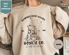 "Vintage Hundred Acre Woods, Honey Co Sweatshirt, Retro Winnie The Pooh Est 1926, Classic Pooh Bear Crewneck ORDERING: 1. Review all photos 2. Choose Size and Color from drop-down menu 3. If personalization box is available, add your text color 4. Add each shirt to cart one at a time 5. Click \"Add to Cart\" - you can go back to add more products 6. Click \"Proceed to Checkout\" 7. Add note to seller for any requests * We use several different brand shirts, all of them are premium quality and soft shirts. The brands we send may vary depending on our stock situation. * We guarantee 100% satisfaction. The brands we use in- clude premium quality shirt brands such as Bella Canvas, Gildan Soft Style, Circle, Outlash. BULK DISCOUNTS AND SPECIAL REQUESTS: We offer bulk discounts and are open to s Vintage Winnie The Pooh Shirt, Pooh Bear Sweatshirt, Winnie The Pooh Crewneck, Winnie The Pooh Shirt Ideas, Winnie The Pooh Outfit Ideas, Winnie The Pooh Clothes Women, Winnie The Pooh Sweatshirt, Retro Winnie The Pooh, Classic Pooh Bear