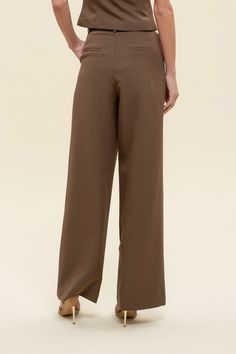 Office chic to date night to weekends looking cutie while on-the go, dress to impress in our Greenwich pleat trousers. These high-waisted pants feature a hook and eye closure, belt loops, back pockets, slick side pockets, pleated detailing, a wide leg with a flared hemline, and let's not forget they are the color of the season - chocolate BROWN! Designed in the USA. Imported Fabric Content: 88% Polyester, 12% Spandex. Inner Lining: 100% Polyester Model is 5'6 and is wearing a size Small. Spring Date Night Bottoms With Belt Loops, Belted High Waist Bottoms For Date Night, Chic Solid Color Wide-leg Dress Pants, Elegant Belted Solid Wide Leg Pants, Chic Solid Color Wide Leg Dress Pants, Elegant Solid Color Belted Wide Leg Pants, Chic Solid Wide Leg Dress Pants, Chic Wide Leg Dress Pants For Business Casual, Belted Bottoms For Date Night