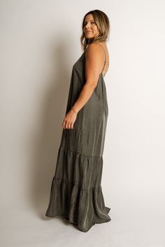 COLOR: Ash Grey Wash FIT: Runs true to size. MODEL: Breanna is 5’ 1” / wearing a small. MATERIAL: 100% Tencel GARMENT DETAILS: Maxi-length, adjustable spaghetti straps, elastic back, and tiered composition. CARE: Hand wash cold mild detergent, do not bleach, lay flat to dry, light steam if needed or dry clean. MEASUREMENTS: FLAT LAY & ARE APPROXIMATE SIZE LENGTH BUST WAIST SMALL 54” 40” 22” MEDIUM 55” 42” 23” LARGE 56” 44” 24” Casual Maxi Dress With Adjustable Straps For Brunch, Spaghetti Strap Maxi Dress With Adjustable Straps For Brunch, Flowy Cotton Maxi Dress With Adjustable Straps, Cotton Maxi Dress With Adjustable Straps For Brunch, Casual Slip Dress With Adjustable Straps For Vacation, Casual Slip Dress With Spaghetti Straps For Brunch, Cotton Maxi Dress With Spaghetti Straps For Brunch, Casual Slip Dress With Straps For Brunch, Casual Flowy Maxi Dress With Adjustable Straps