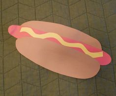 a paper cut out of a hot dog