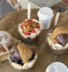 three desserts and drinks on a wooden table